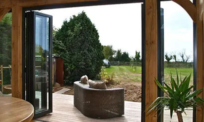 Patio Door Trends for 2020 - Bi-fold Doors overlooking countryside garden